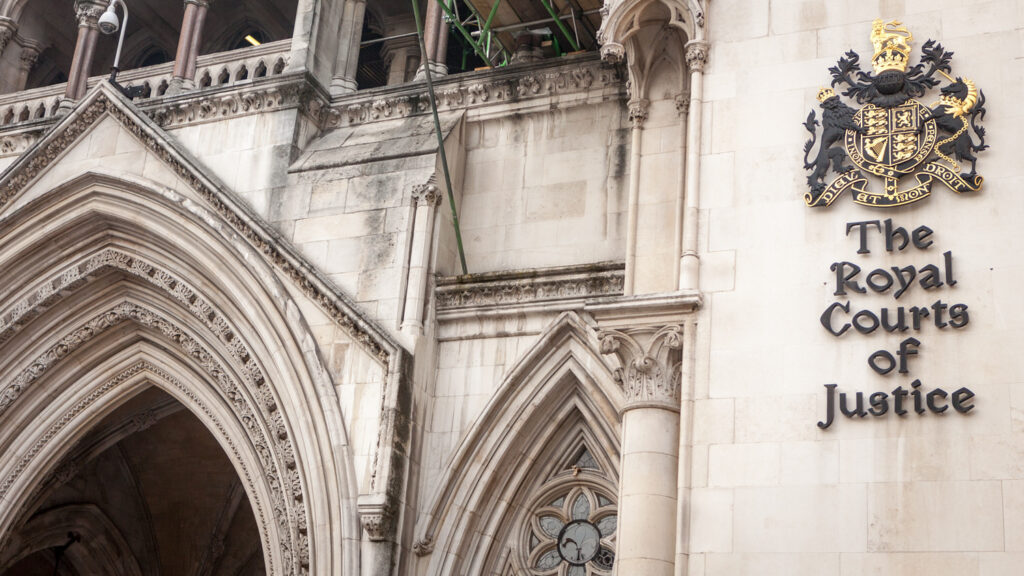 The Royal Courts of Justice sign on building facade