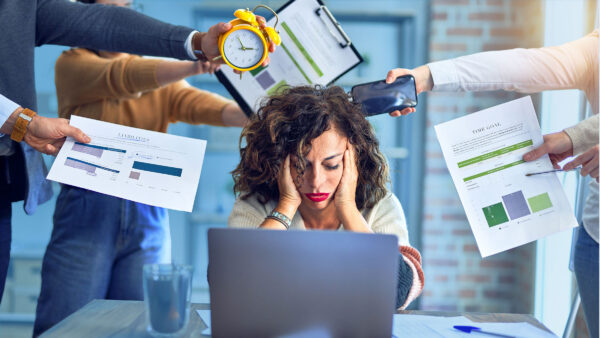 A HR employee looks very stressed at work